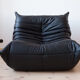 Armchair and ottoman in black leather model designed by Michel Ducaroy 1973