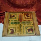 old wooden game board: small horses and checkers