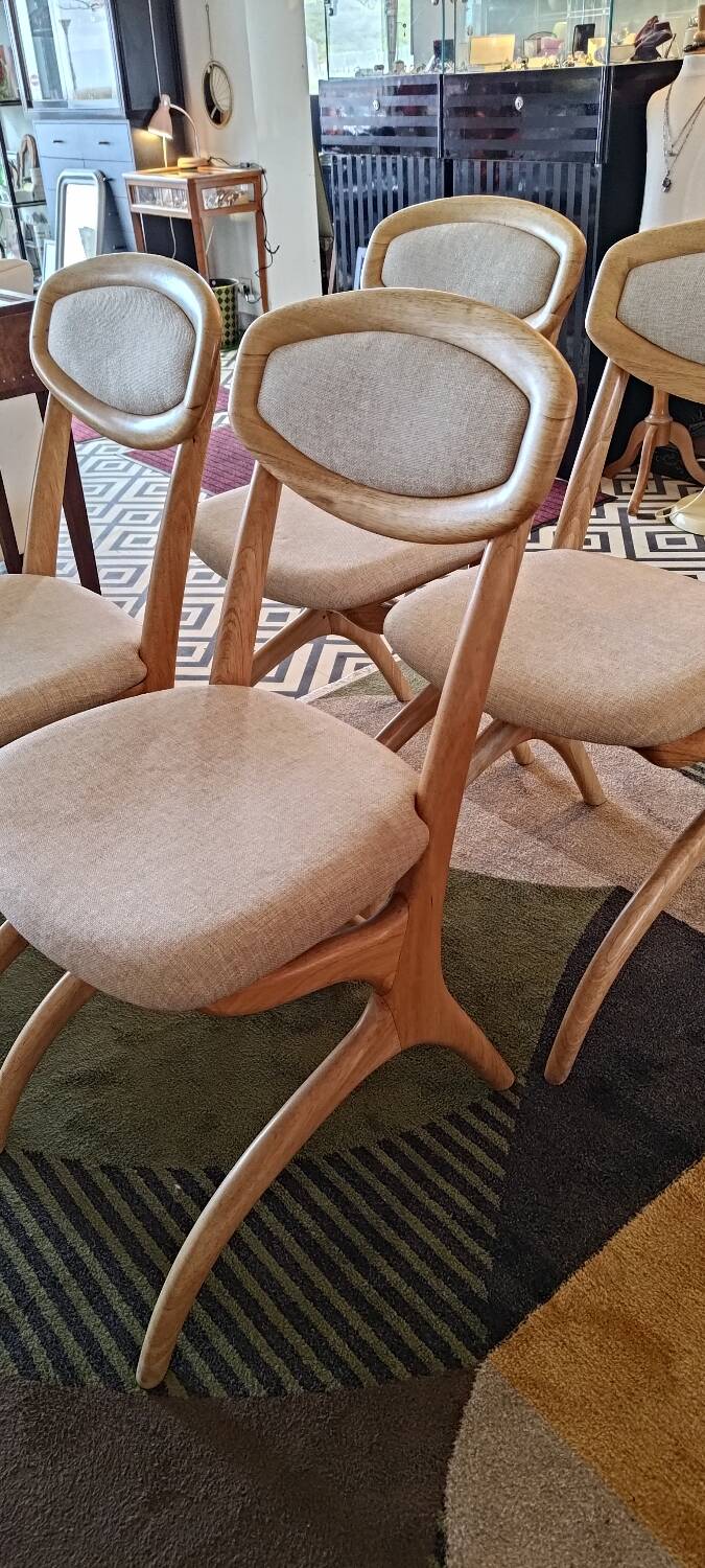 Four Scandinavian-style chairs