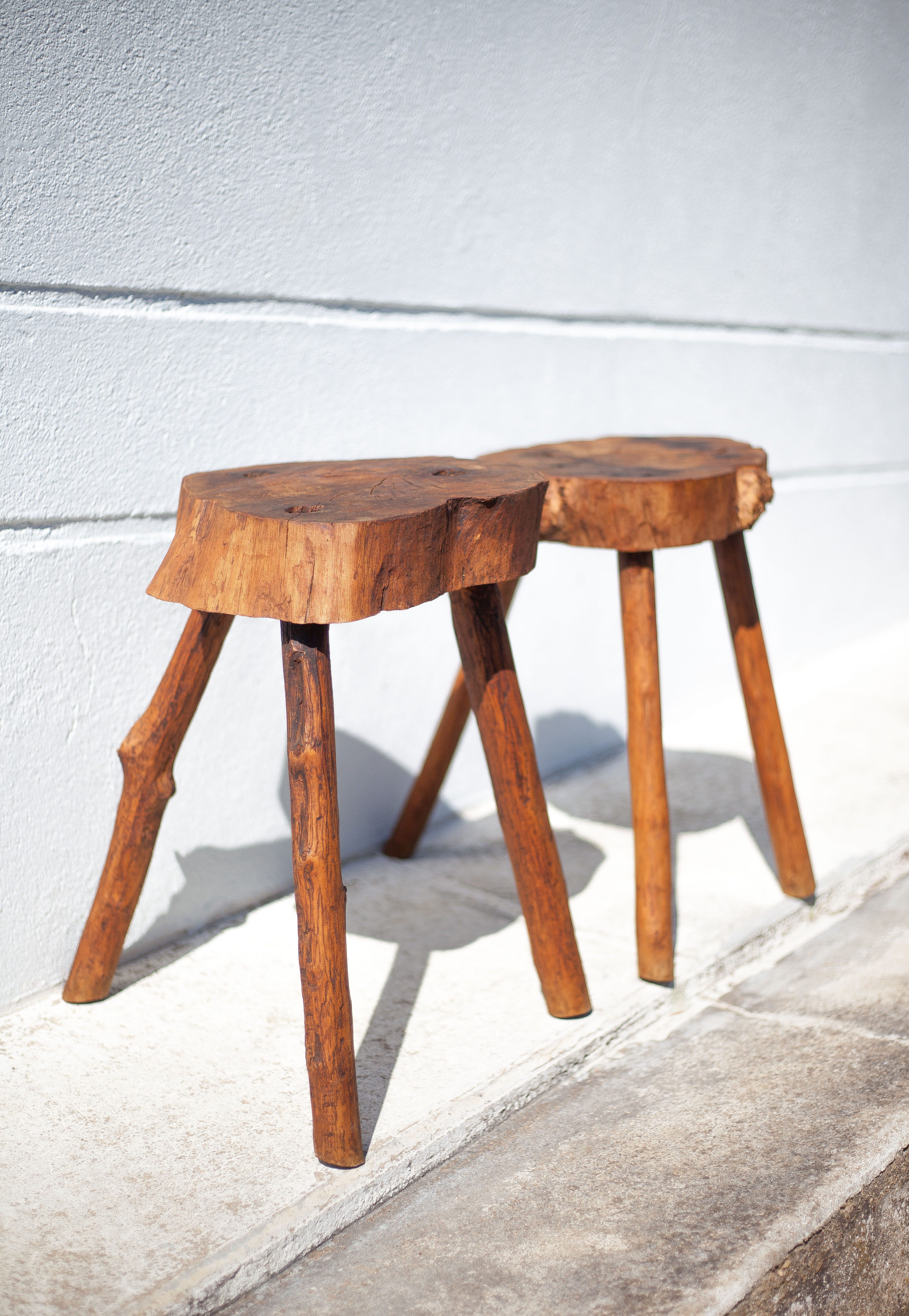 Pair of brutalist tripod wood stools