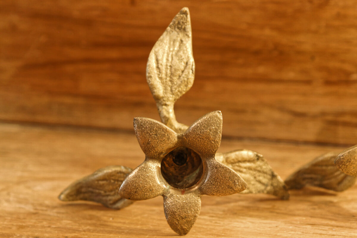 Pair of brass candle holders, flowers