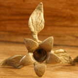 Pair of brass candle holders, flowers