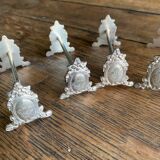 Series of 12 monogrammed silver metal knife holders