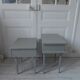 Duo of bedside tables, vintage mismatched verdigris end tables.