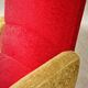 Red and mustard yellow fabric armchair in 1970s style