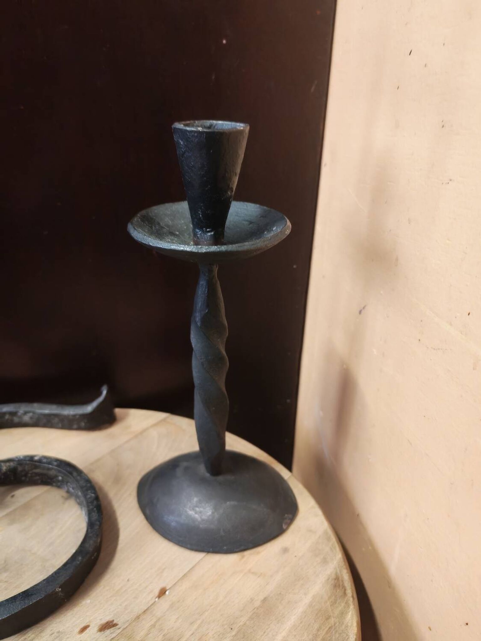 Set of 3 candlesticks and a candle holder in wrought iron.