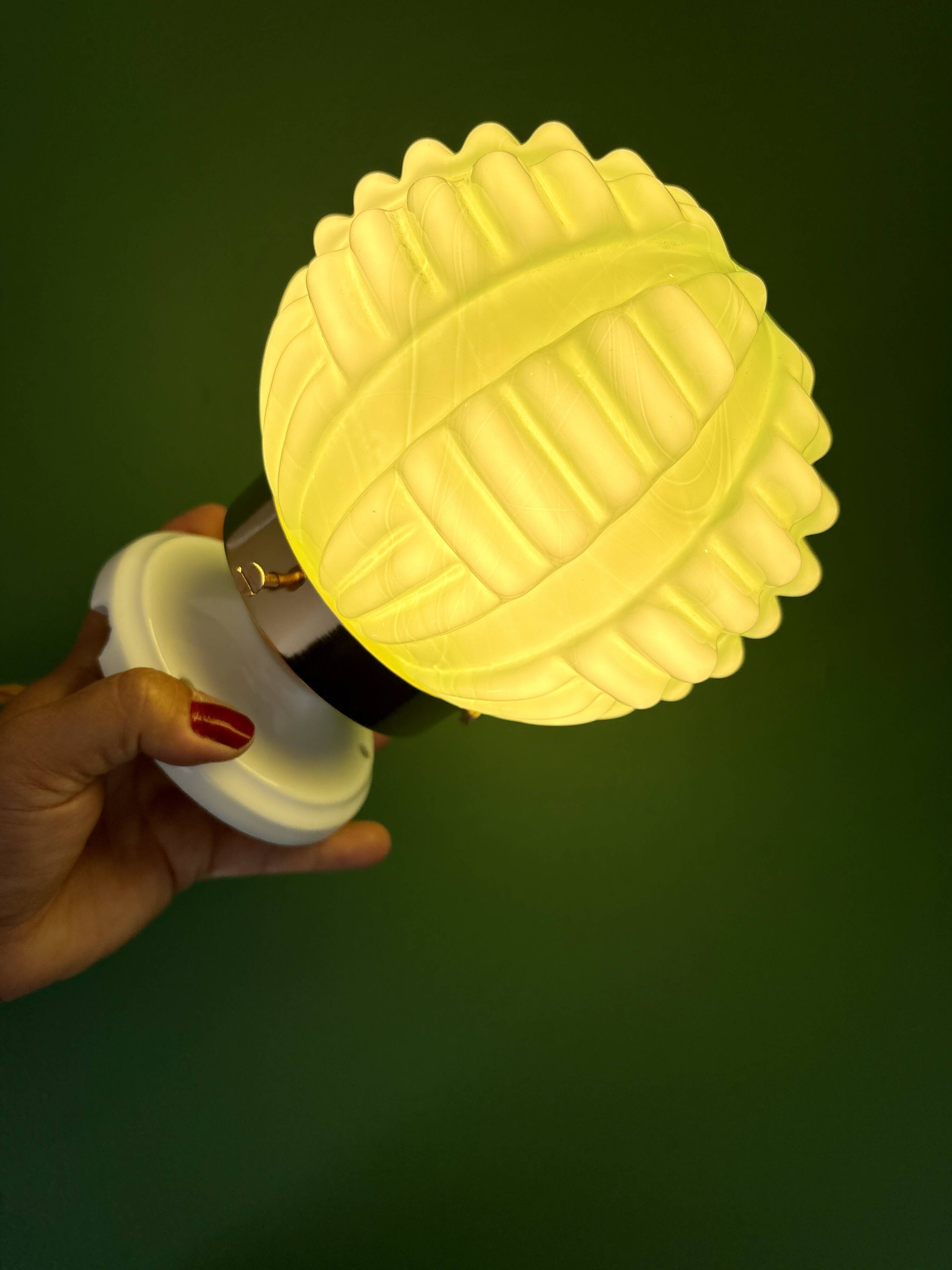 Vintage Art Deco globe wall light in pale green opaline.