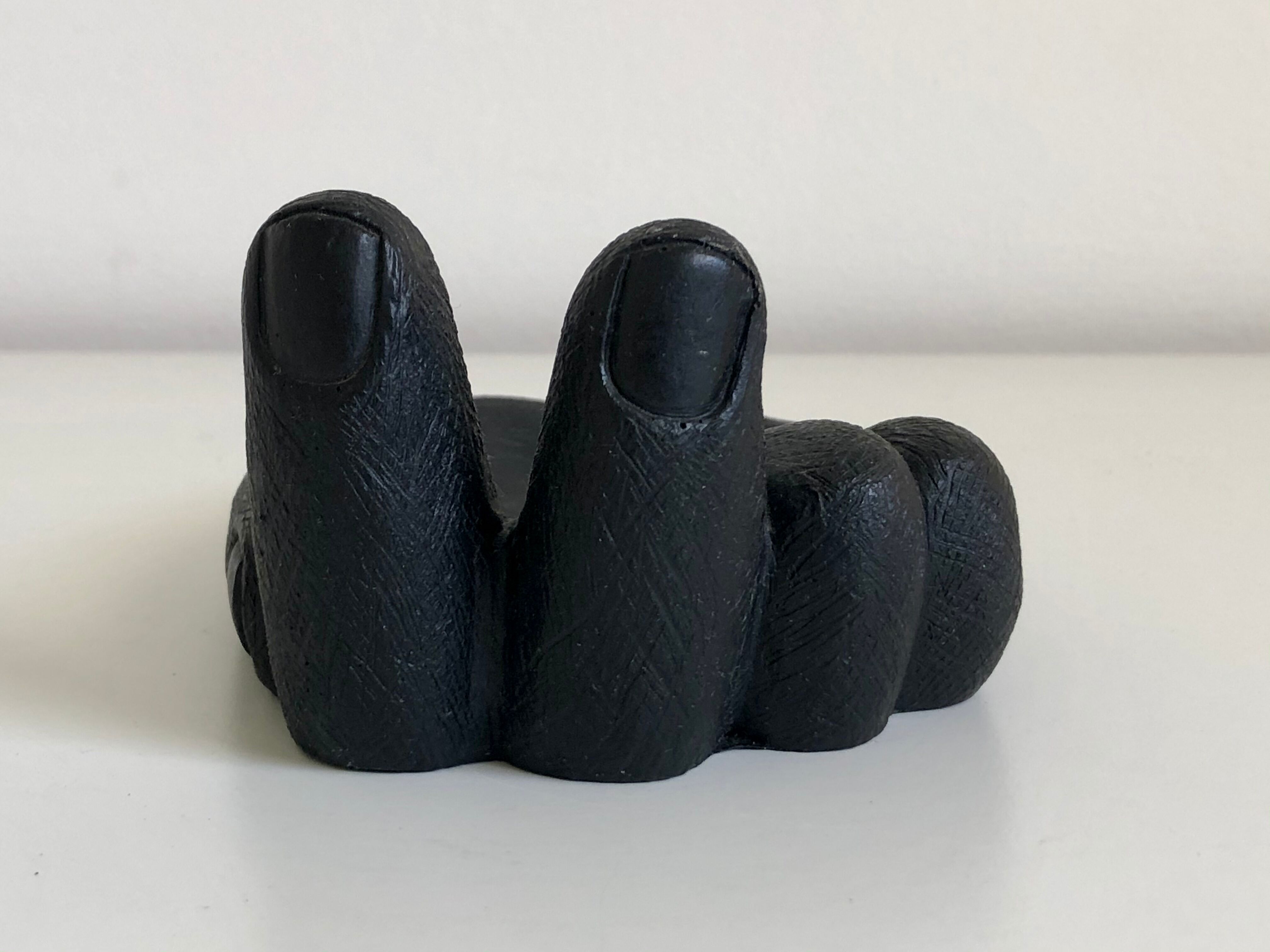 Empty pocket in Hawaiian lava in the shape of a hand signed Coco Joe, 1960