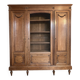 Three-door glass display cabinet with a grille in the Louis XVI style, antique and decorated.