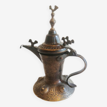 Old jug, oriental bronze coffee maker.