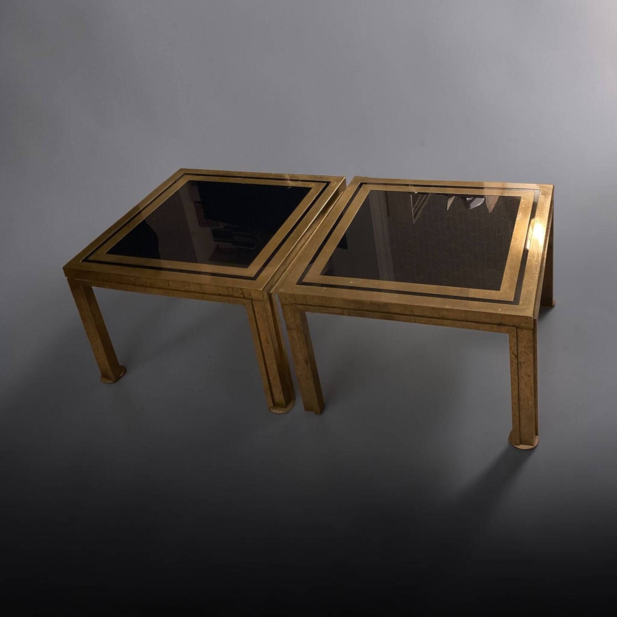 Pair of Romeo Rega side tables in brass and smoked glass, Italy 1970.