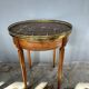 Hot water bottle table with a marble top and a brass gallery.