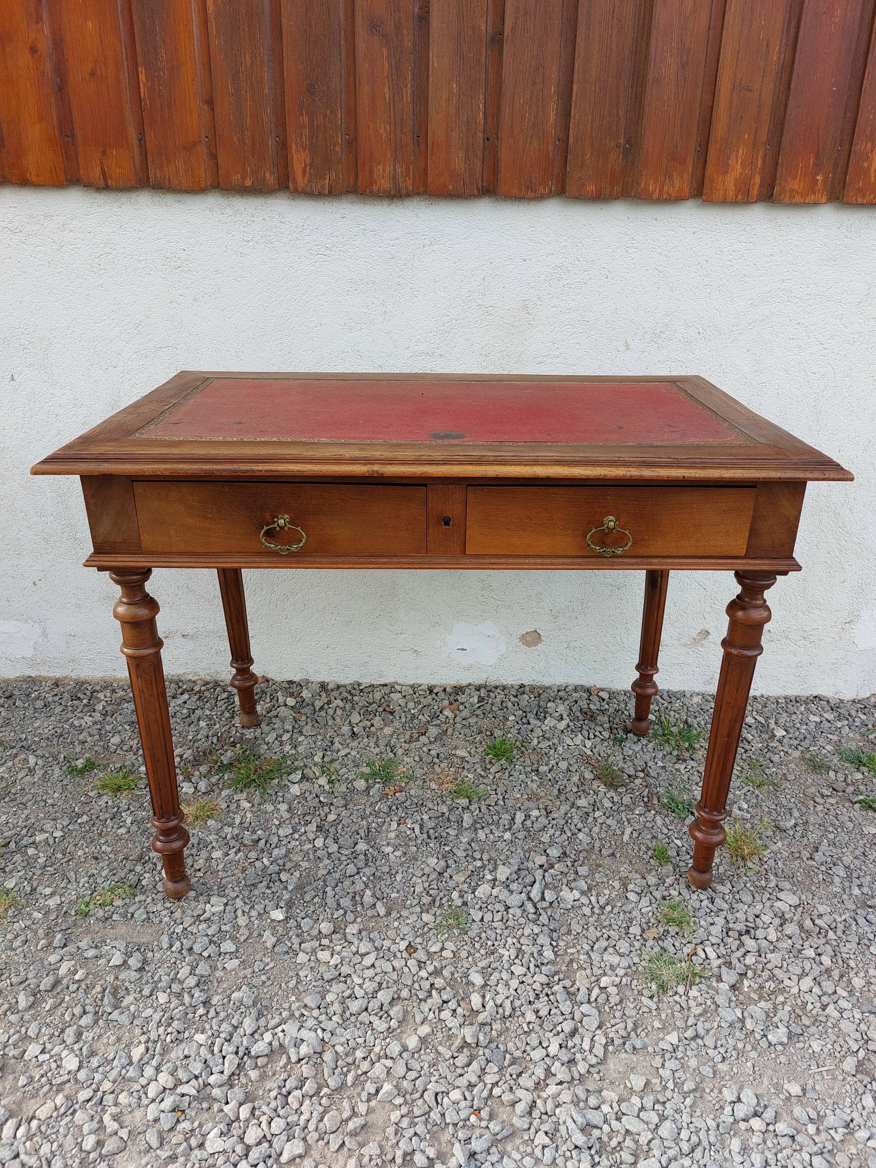 Old wooden desk, red felt top