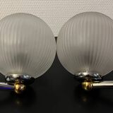 Pair of Inda metal and chiseled glass wall lights