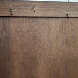 Bonnetière man standing cabinet a door