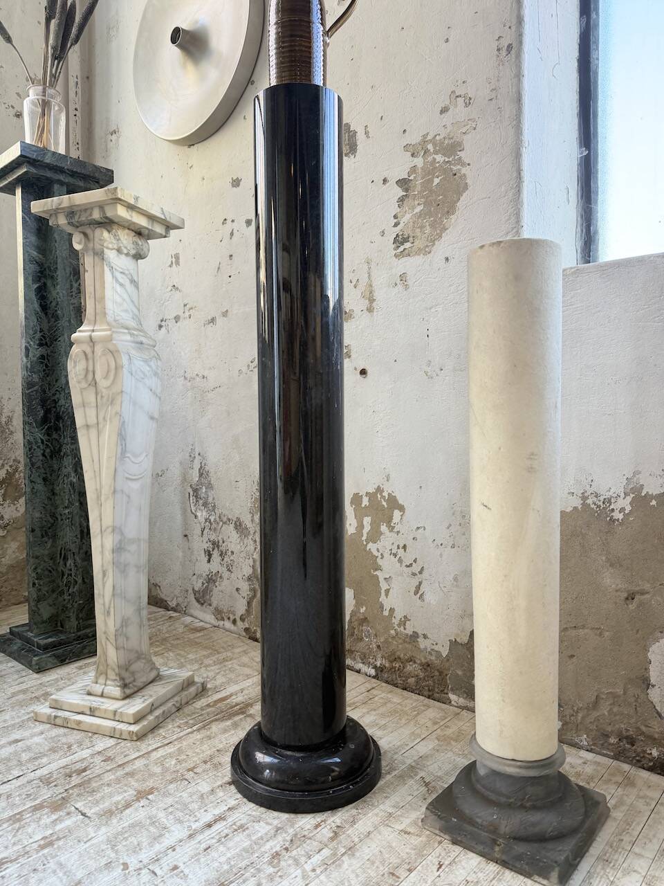 Set of 4 marble columns or pedestals.