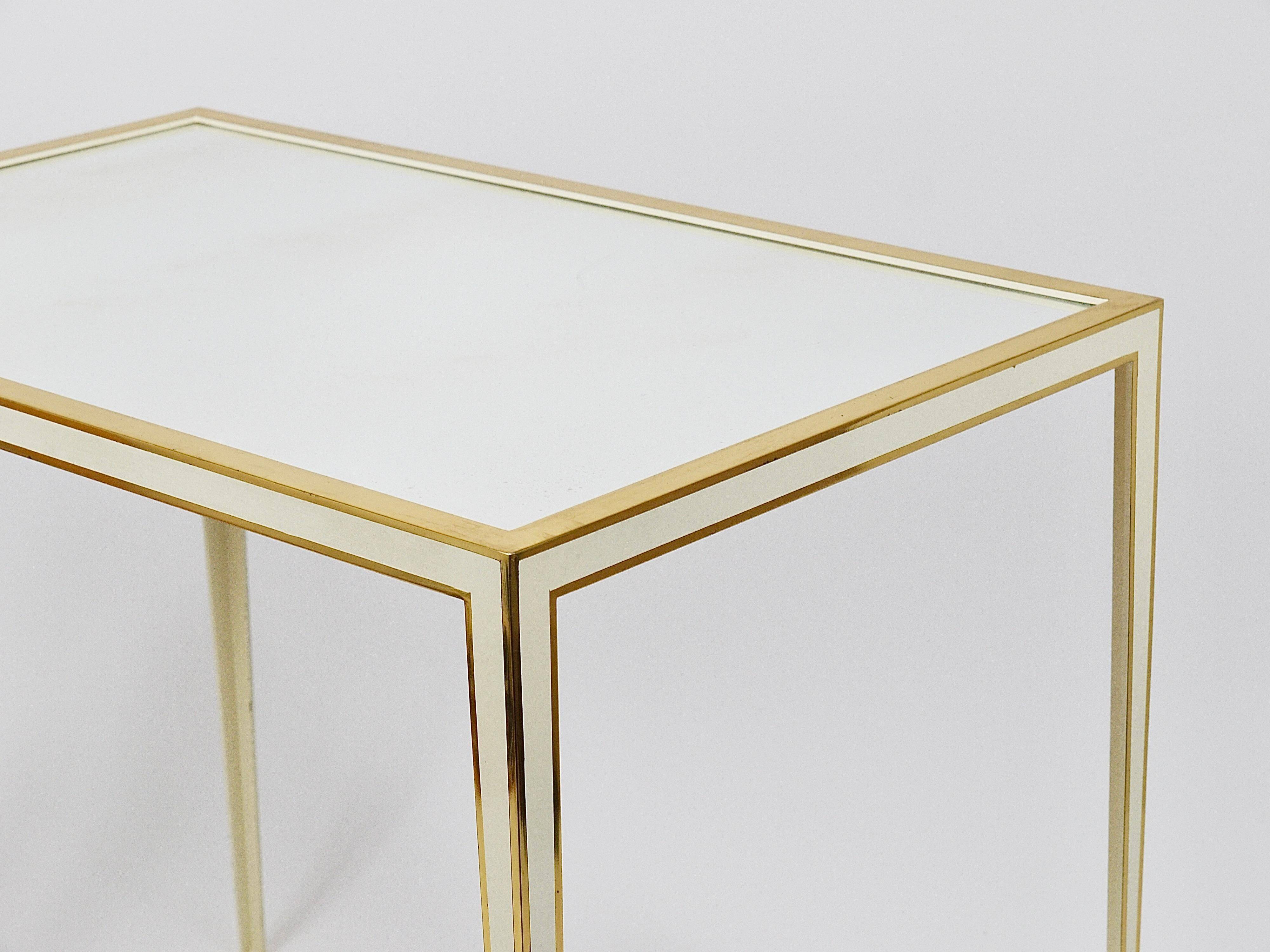 A pair of brass and white mirror tables from Vereinigte Werkstätten, Germany, 1970s.