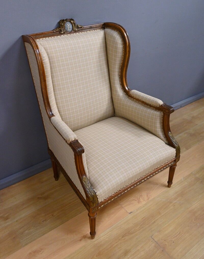 Wingback armchair in walnut, Louis XVI style – late 19th century