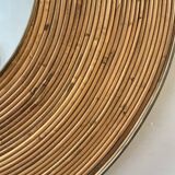 Large round mirror in rattan and brass