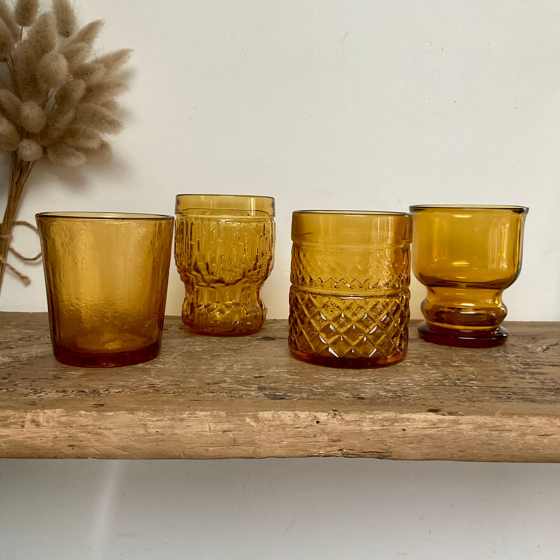 4 mismatched amber glasses