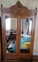 Large antique wardrobe in the Henri II style made of oak and walnut with bevelled mirrors.