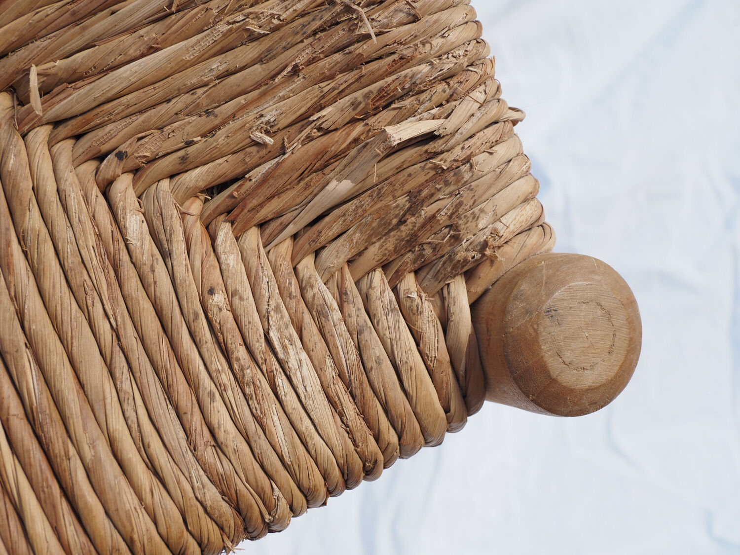 Farm stool made of wood and straw