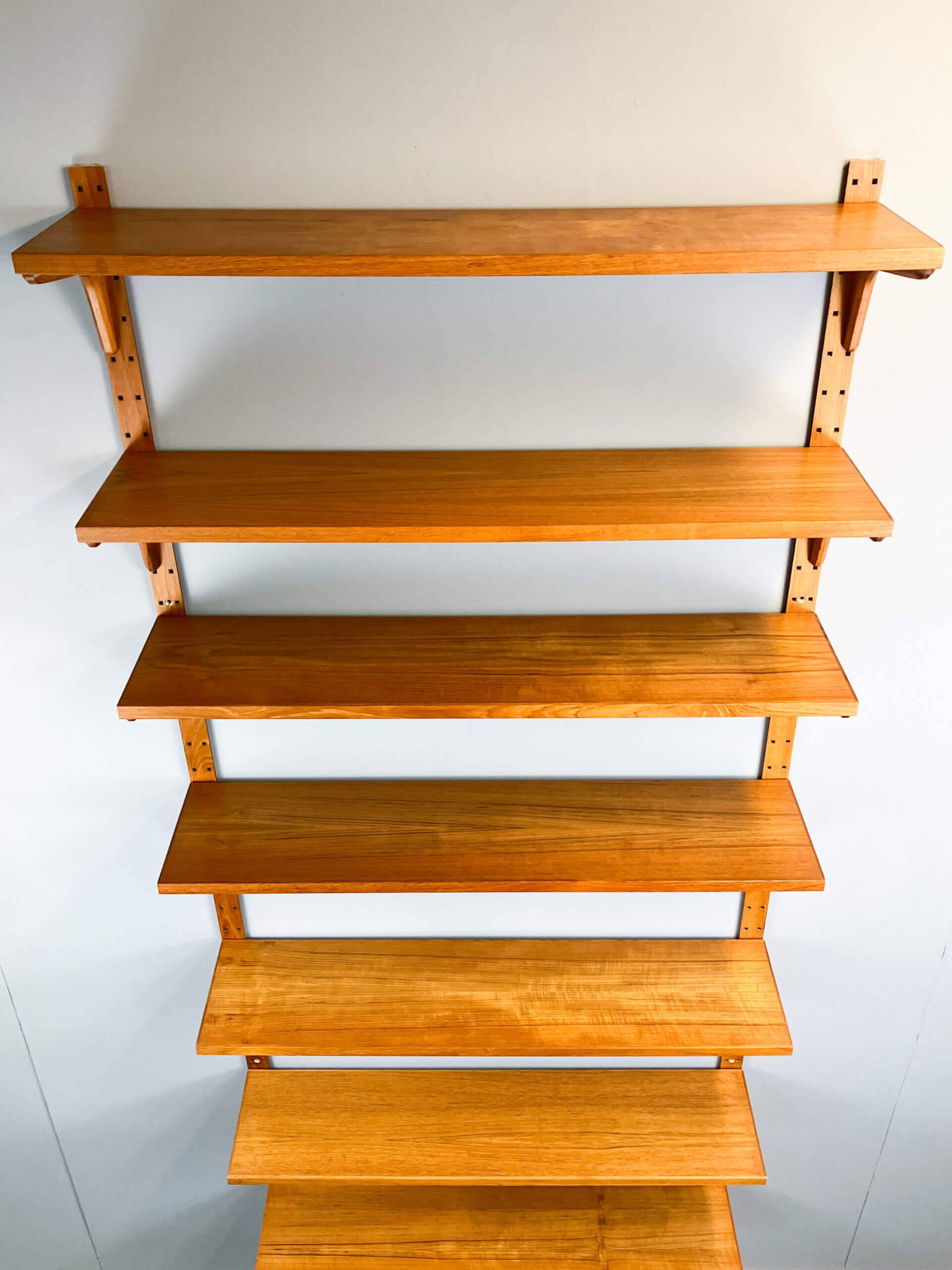 Danish wall shelf by Hansen and Guldborg, teak, aluminum rails, 1960s.