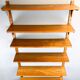 Danish wall shelf by Hansen and Guldborg, teak, aluminum rails, 1960s.
