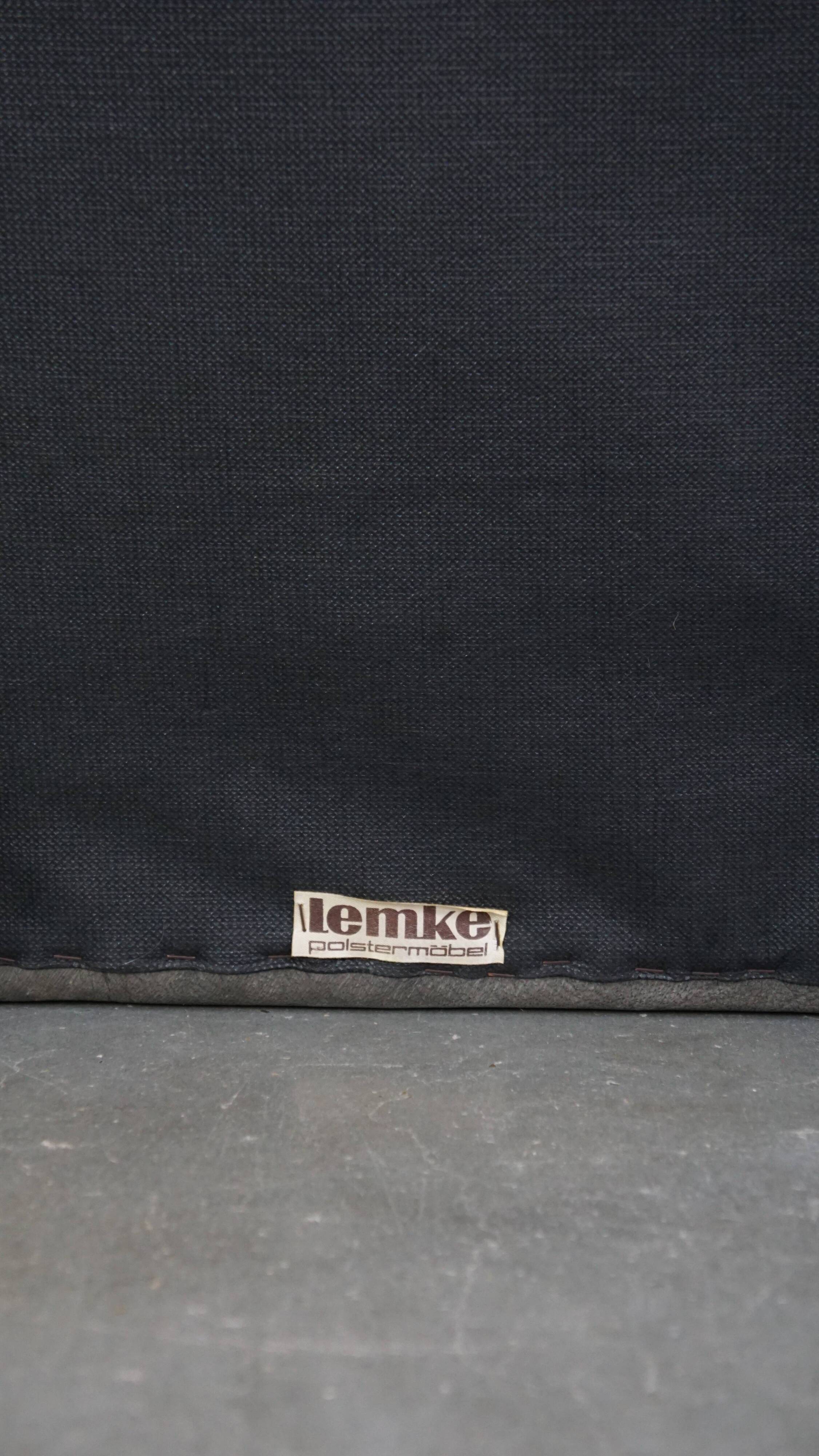Luxurious, comfortable, gray leather vintage footstool