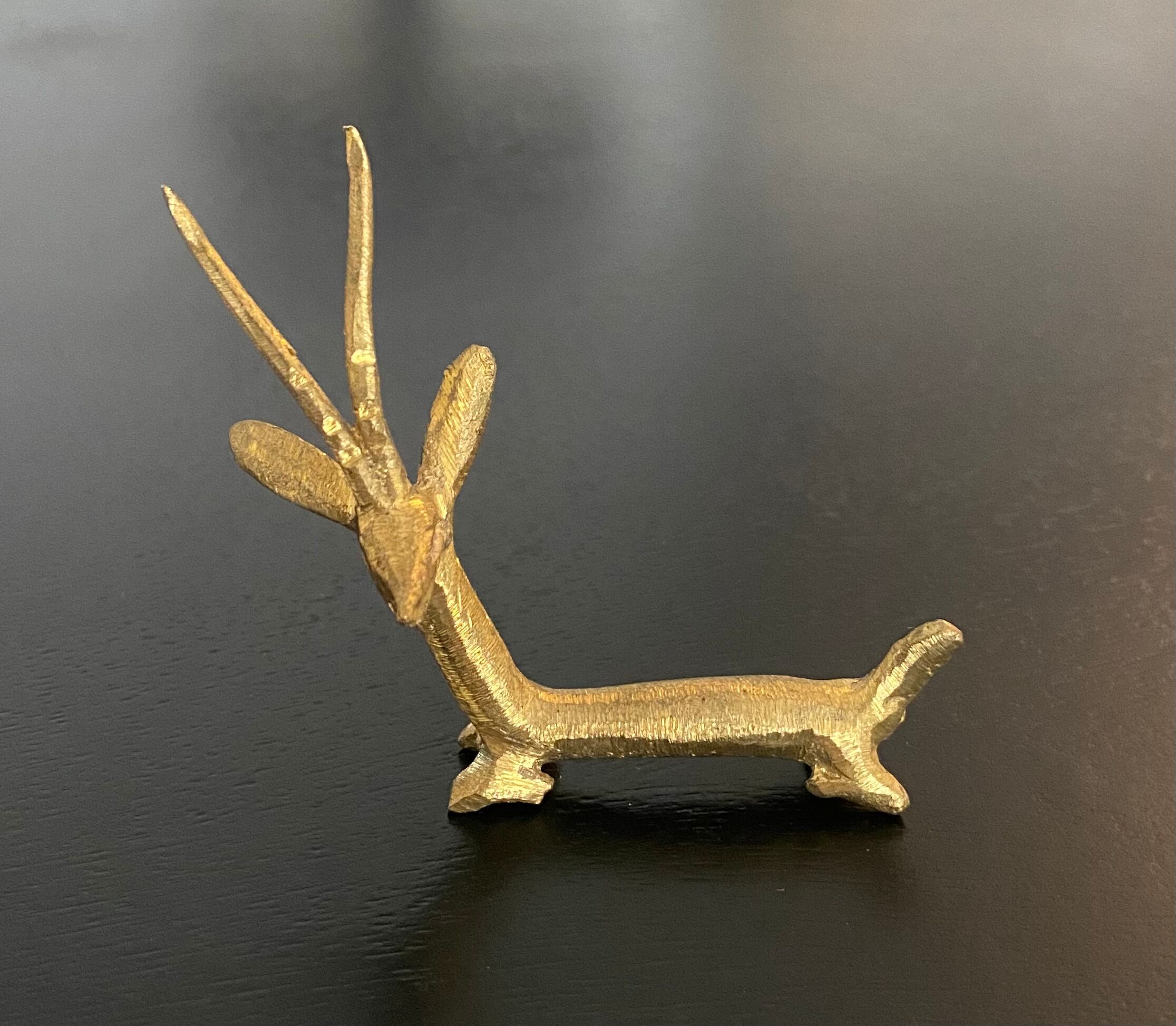 8 porte-couteaux forme antilope et crocodile en laiton