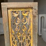 Rectangular Indonesian construction element with blue and yellow plant in carved wood