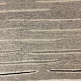 Woven carpet with small diamond patterns