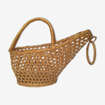 Vintage bottle holder in canned rattan