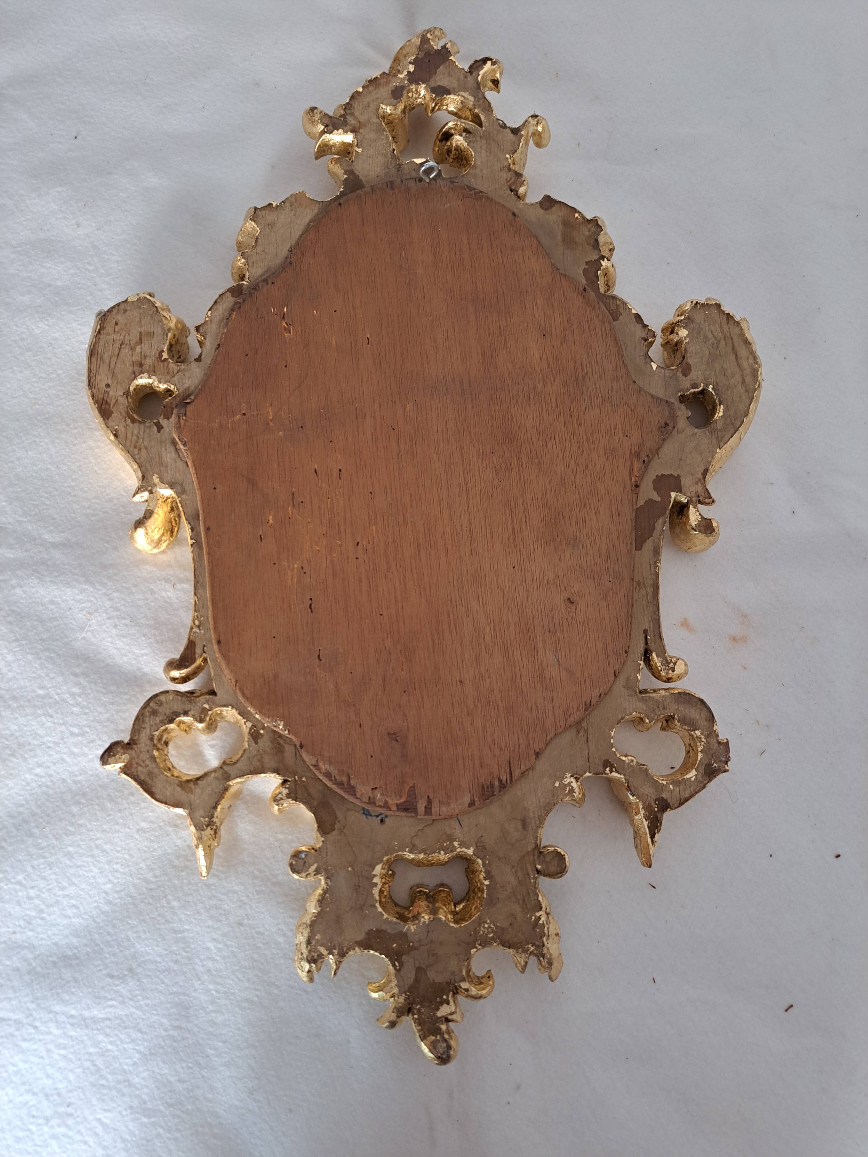 Miroir en bois et doré à la feuille doré