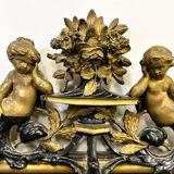 Antique 1800s black and gold mirror with cupid, France 1800s.