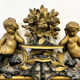 Antique 1800s black and gold mirror with cupid, France 1800s.
