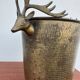 Antique champagne cooler with stag heads