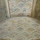 Gondola armchair in Louis XVI style, carved wood with a cream patina.