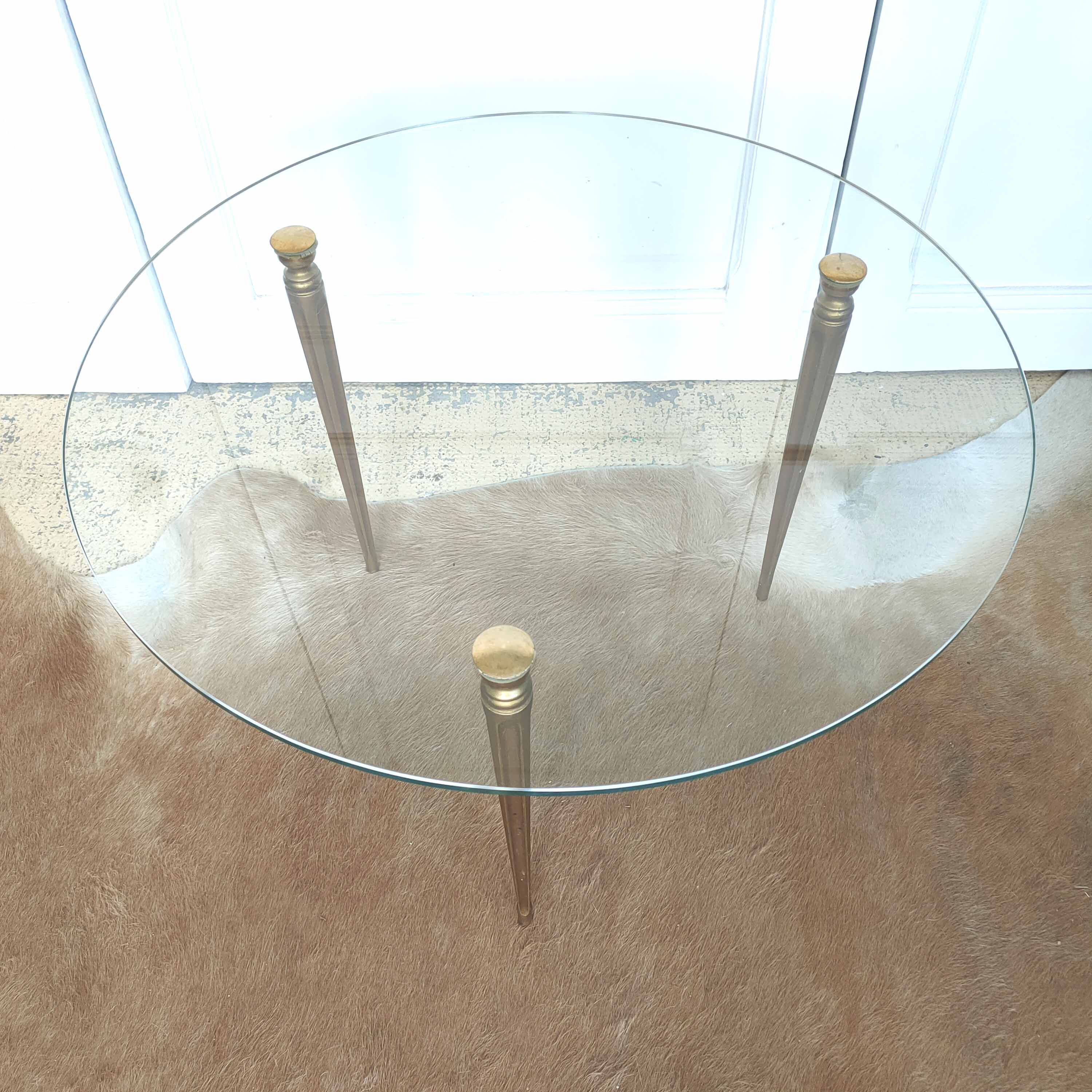 Tripod golden round coffee table