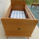 Art Deco baby with its wooden compass feet