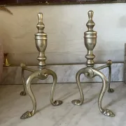 Pair of Victorian brass fire dogs from the late 19th century.