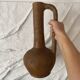 Large terracotta jug, vintage craftsmanship, wabi-sabi.