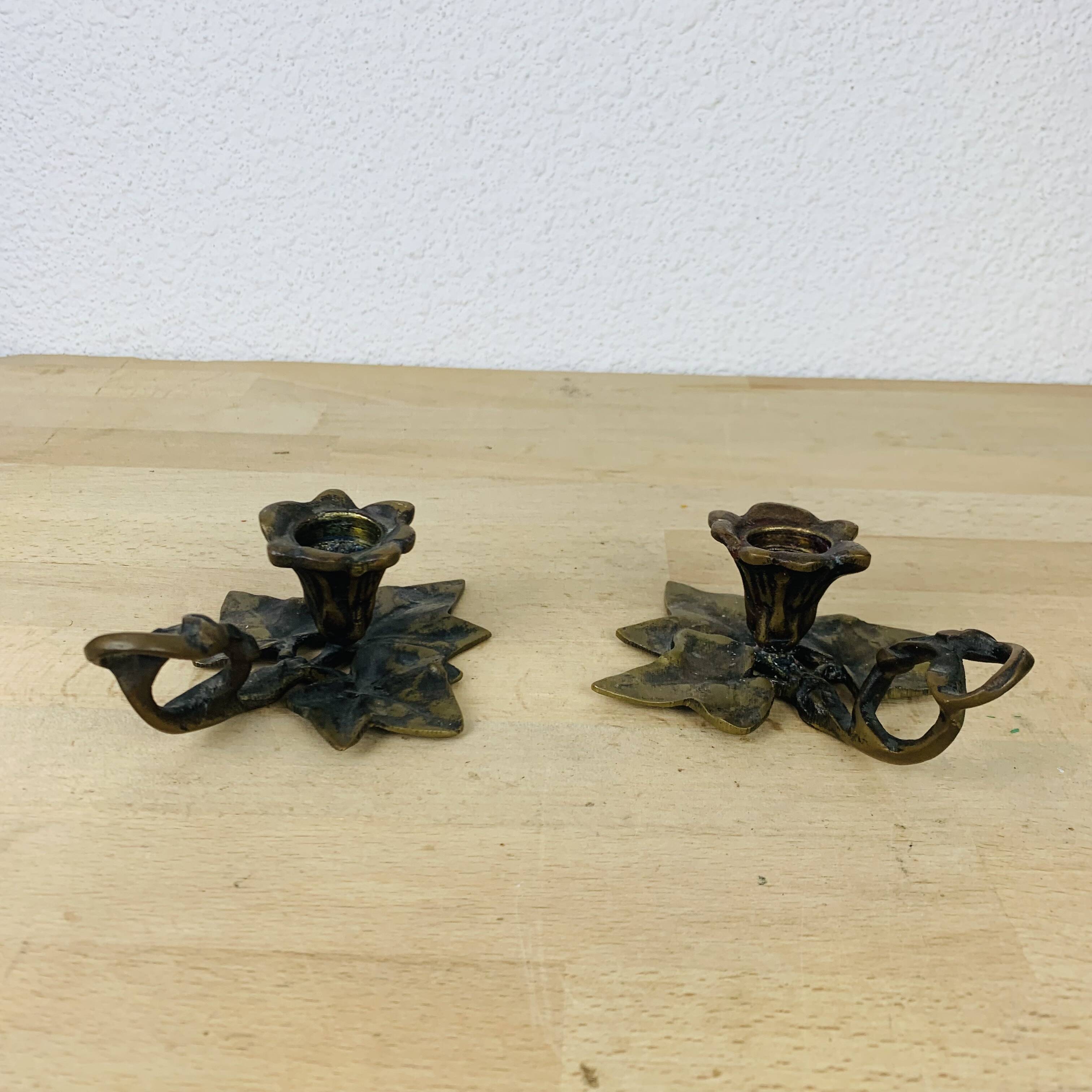 Pair of brass flower candlesticks, cellar
