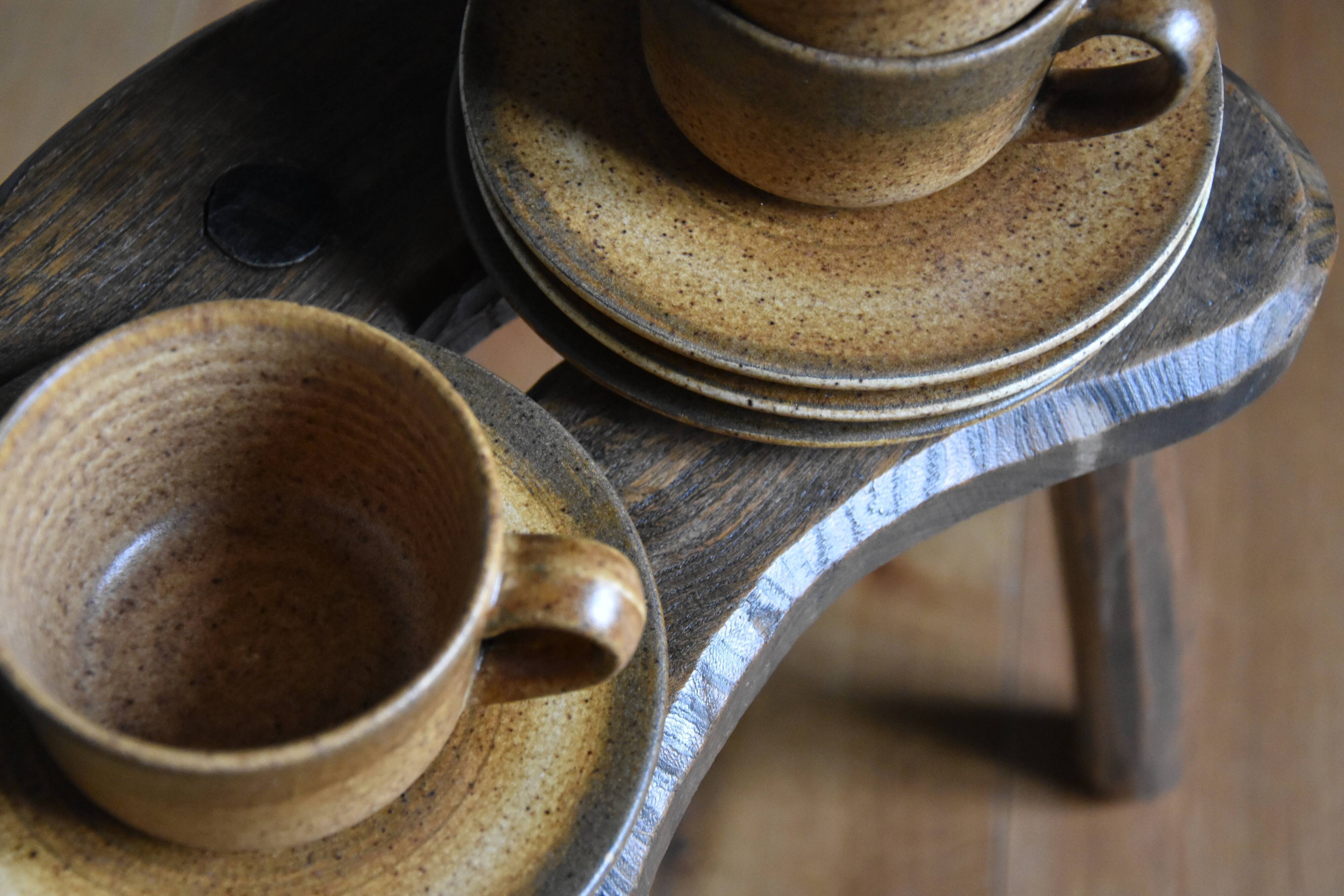 4 sandstone cups and saucers