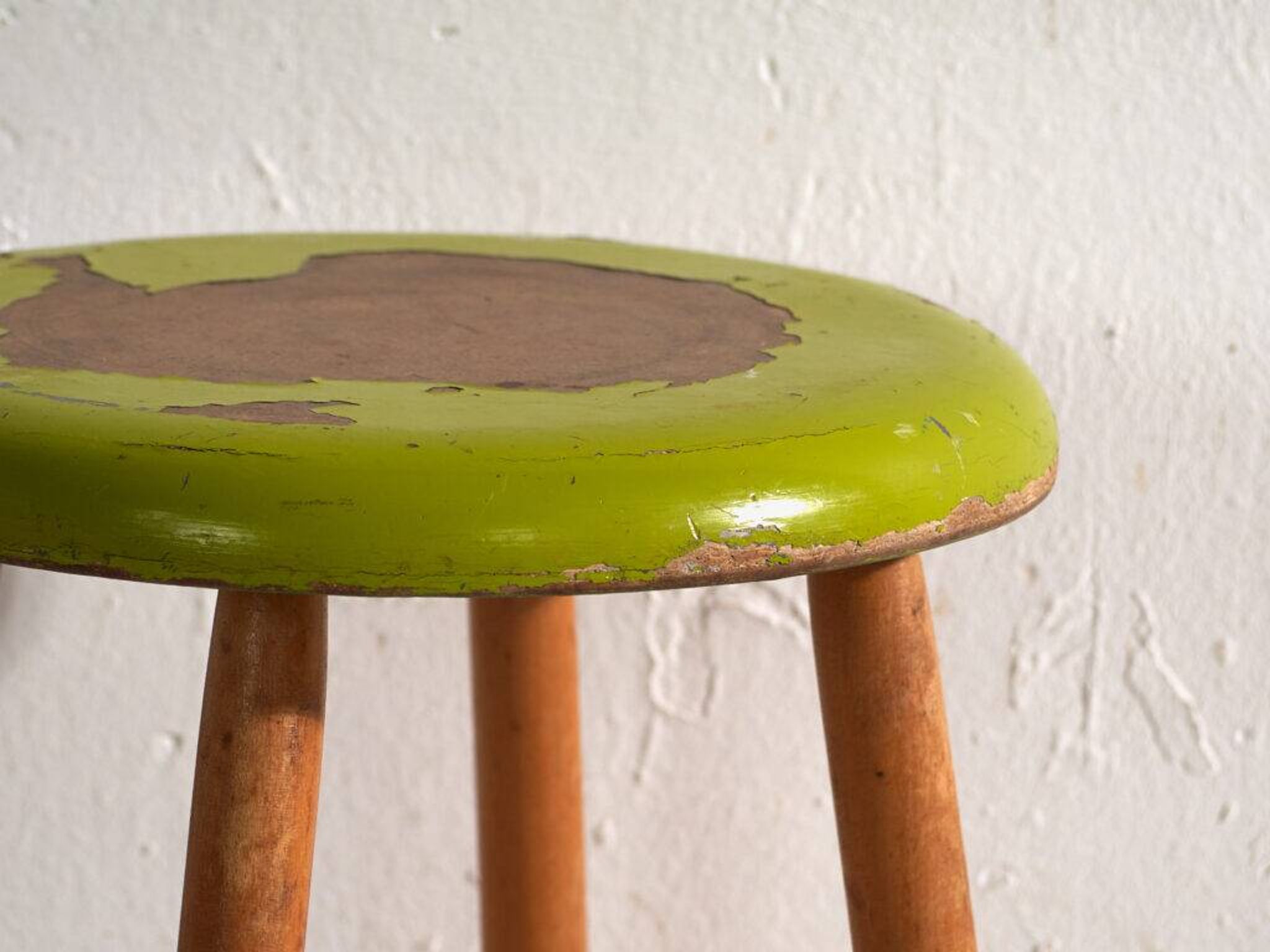 Antique wooden stool with a round seat – Central Europe, circa 1950