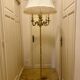 Bronze floor lamp by Lucien Gau, with a six-light shade model 16136.