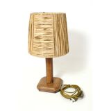 Lamp base in saddle stitched leather and raffia lampshade.