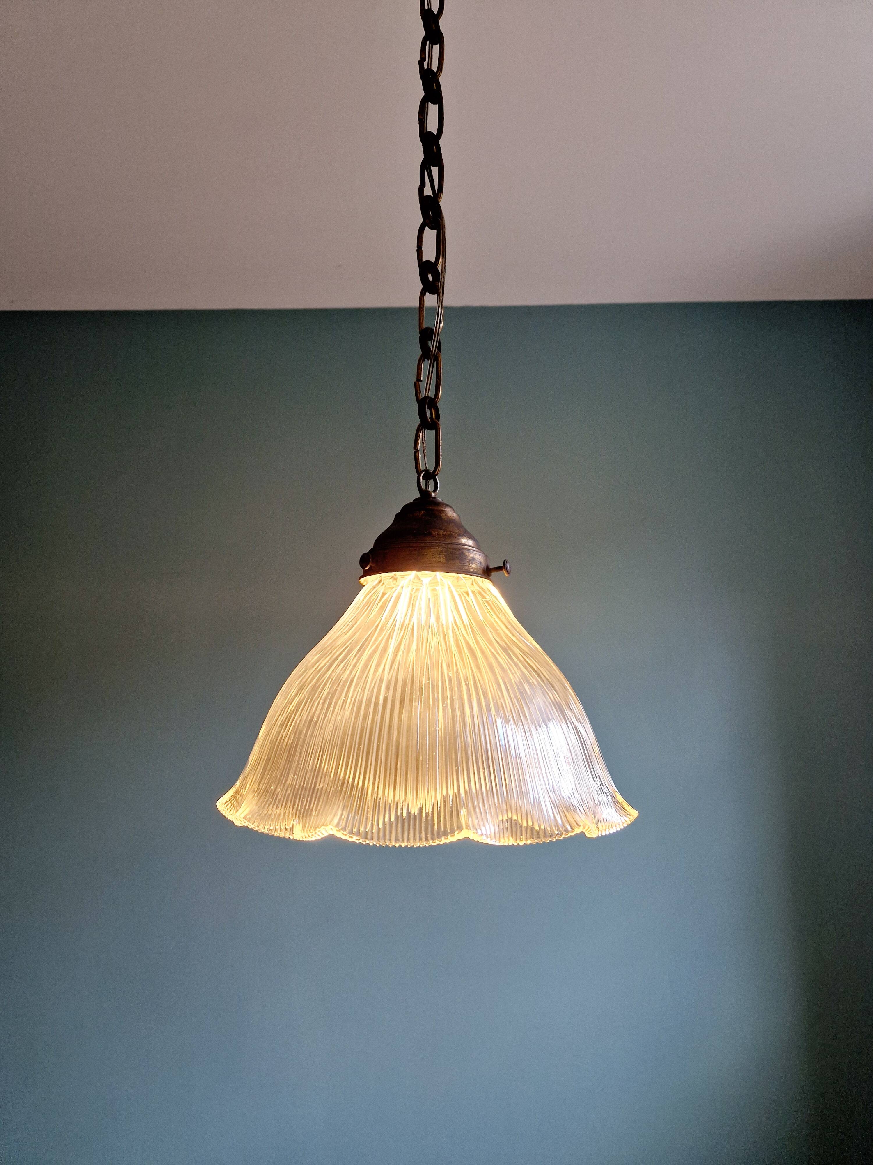Large Holophane pendant light in transparent grooved glass