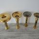 Set of 4 Old Brass Pusher Candle holders