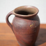 Pot in Norman sandstone of Ger